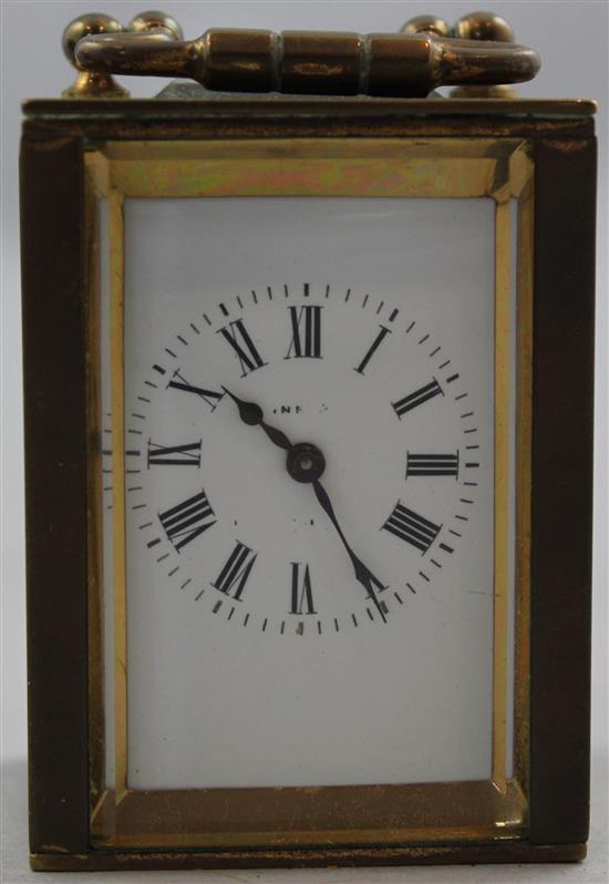 An early 20th century brass miniature carriage timepiece, 2.5in. in travelling case